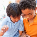 mobile learning - 2 boys collaborating with iPad